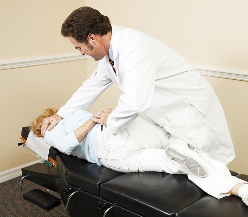 ACG Chiropractor adjusting a patient in his office.